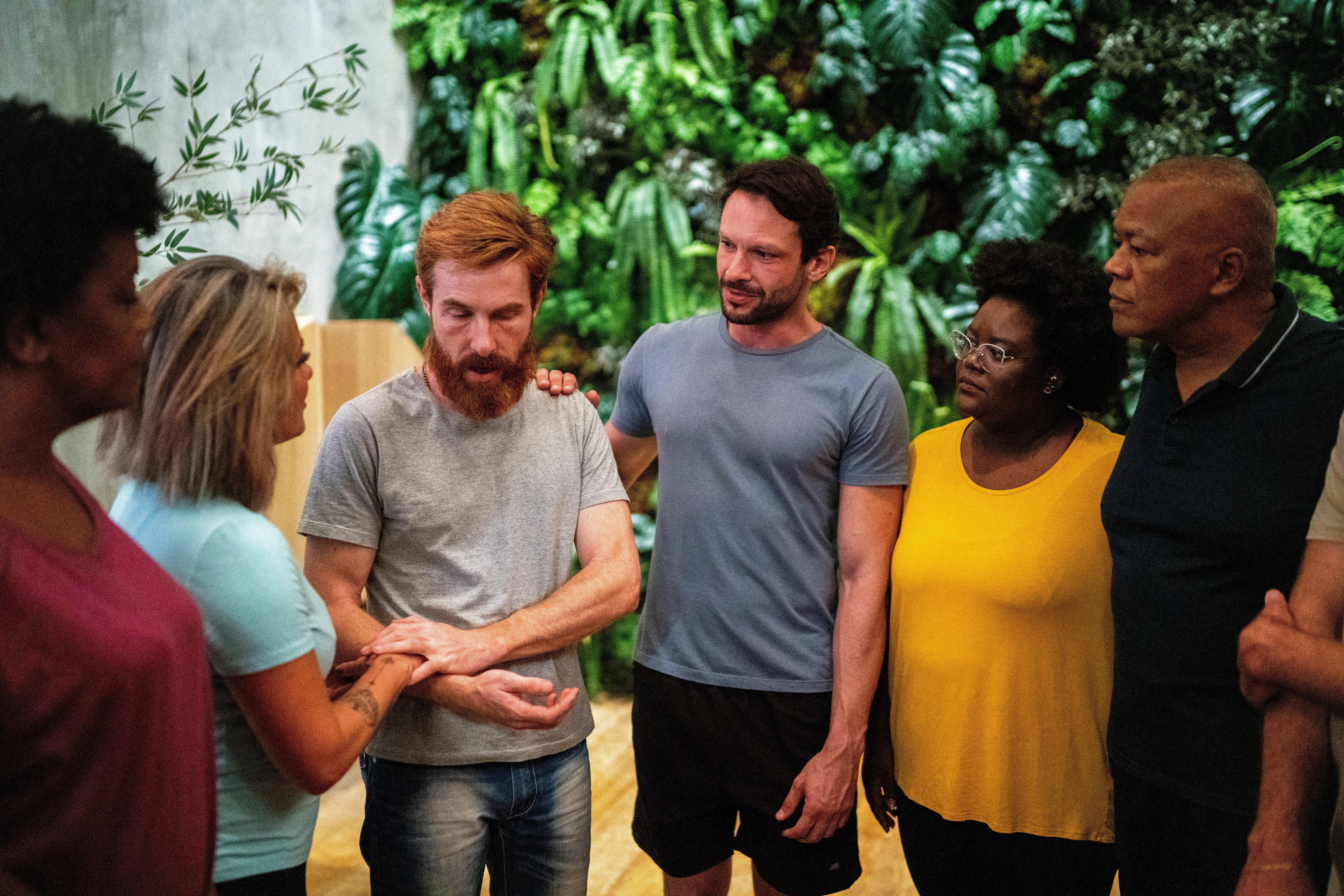 People giving support on a group therapy