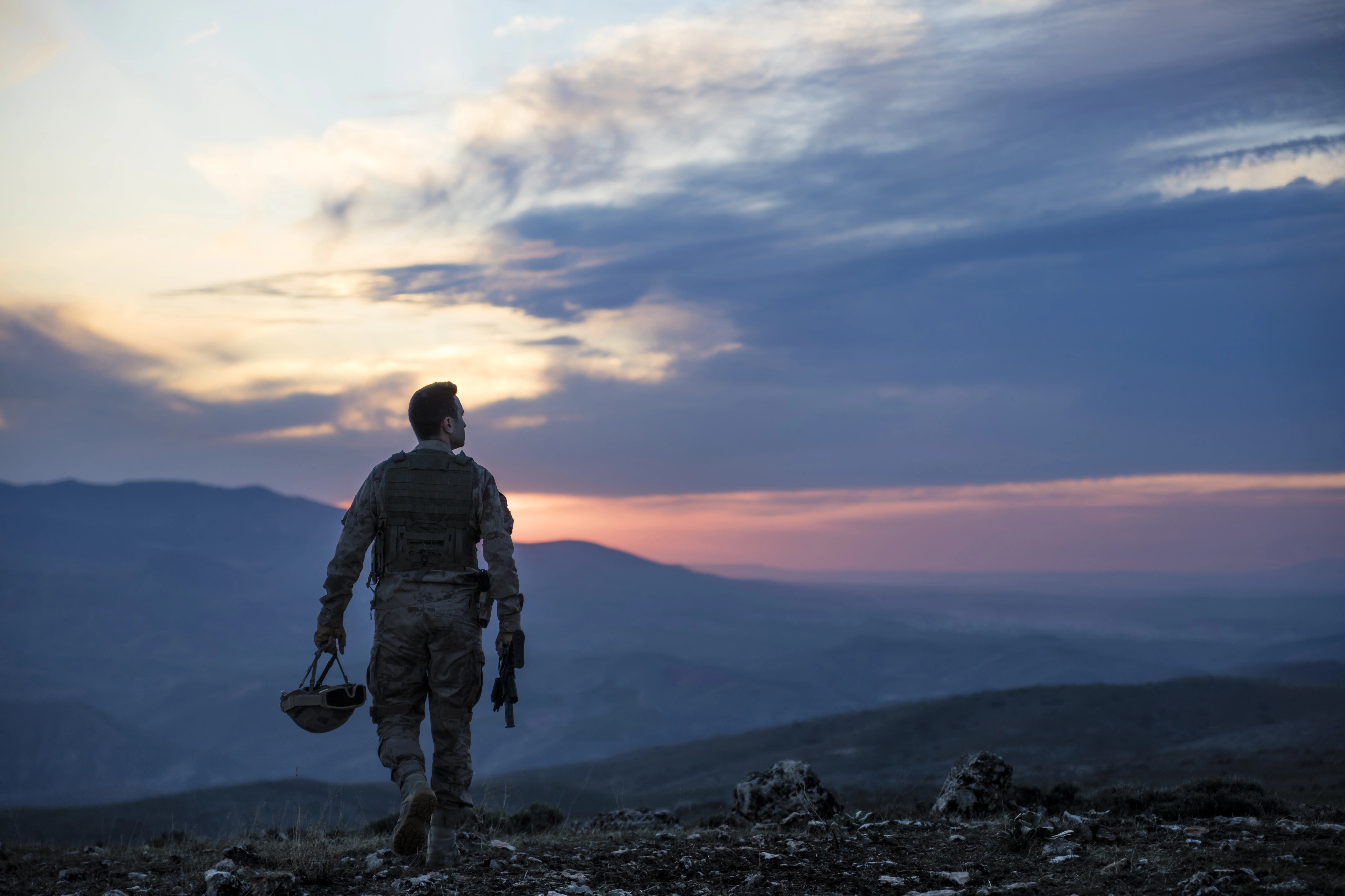 army-soldier-walking-against-sunset-stockpack-gettyimages Army Soldier walking against sunset